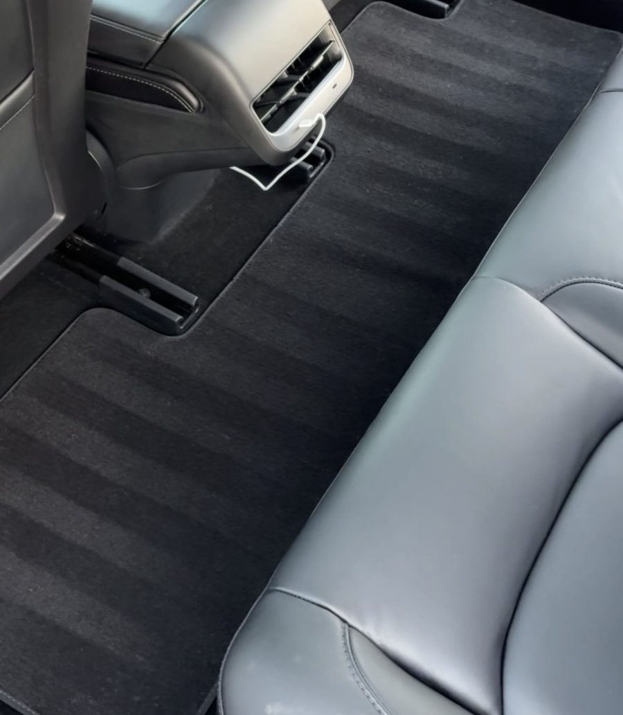 Rear floor carpet after an interior detail: vacuumed, shampooed and groomed, with the rear seat and console wiped clean